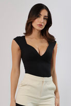 April Seven Beverly Top in black – sculpted fitted top with plunging neckline, cap sleeves, and contoured design.
