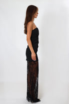 April Seven black strapless maxi dress with lace bottom – elegant floor-length silhouette.