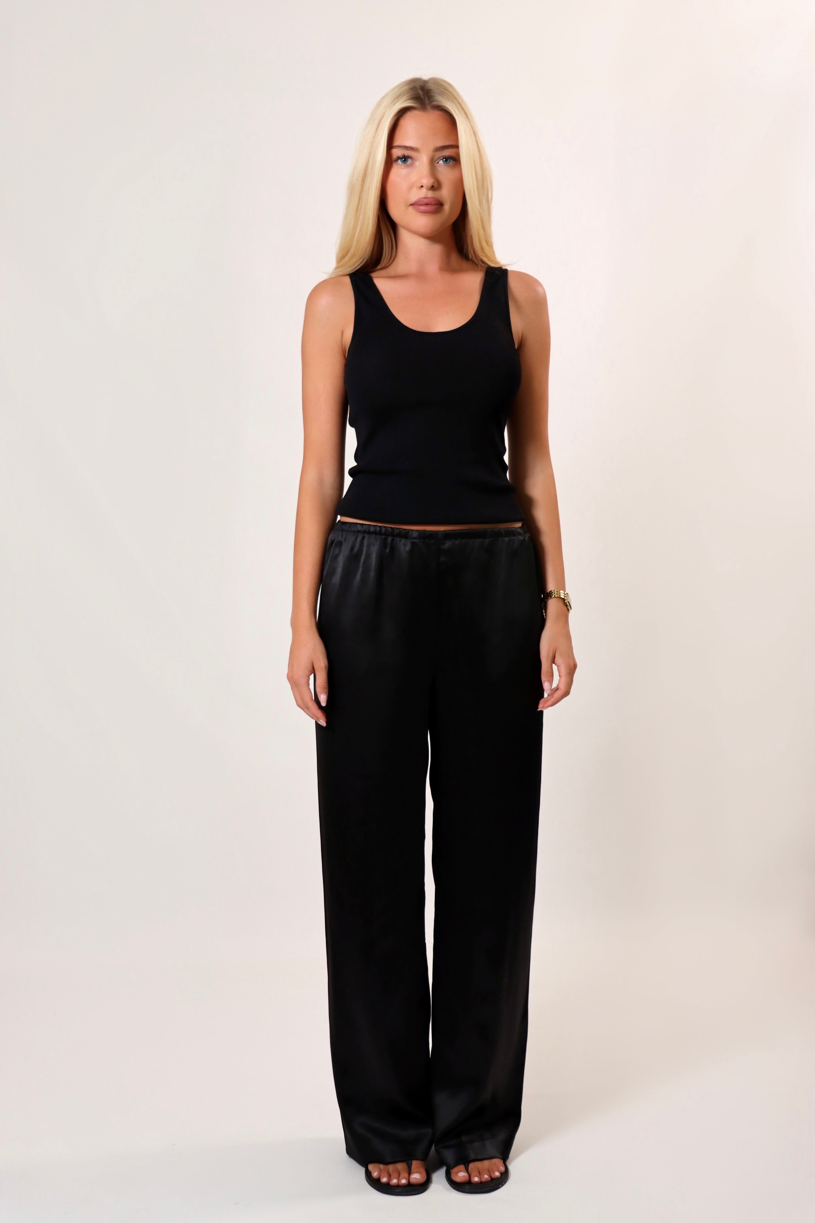Black satin pants with soft drape and elastic waistband – April Seven