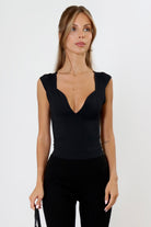 April Seven Beverly Top in black – sculpted fitted top with plunging neckline, cap sleeves, and contoured design.