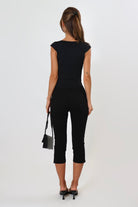 April Seven Beverly Top in black – sculpted fitted top with plunging neckline, cap sleeves, and contoured design.