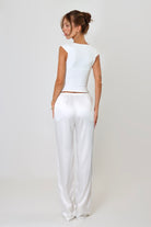 April Seven Beverly Top in white – minimalist fitted top with plunging neckline, cap sleeves, and sculpted silhouette.
