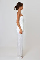 April Seven strapless vest top in white – tailored design with button-up front and flap pockets.